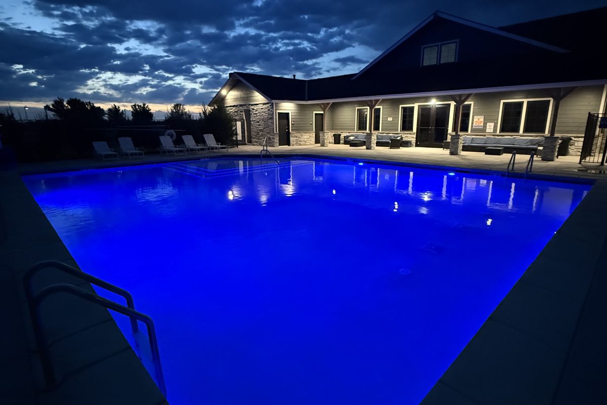 Pool glowing blue at dusk