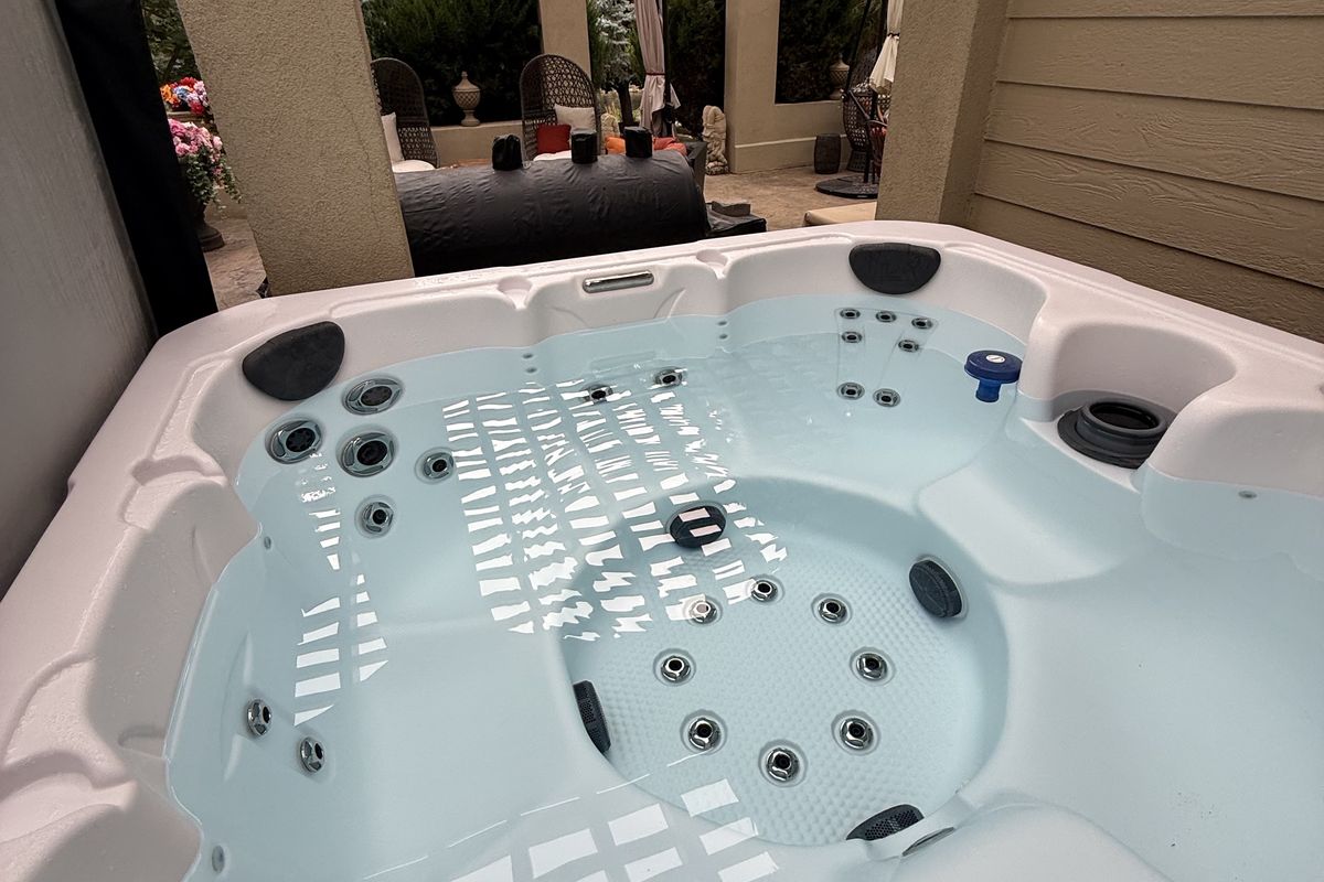 Hot tub under a patio pergola